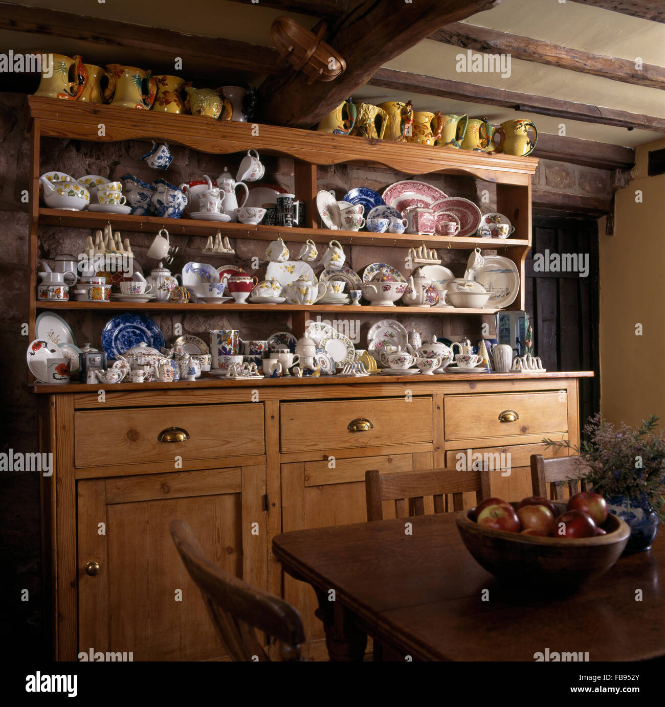 Old Pine Dresser With A Collection Of Vintage China In A Cottage