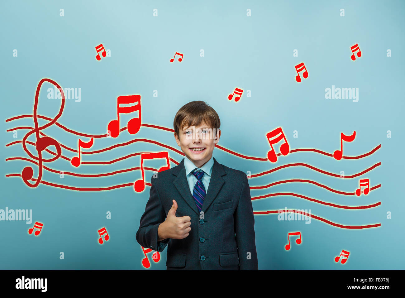 boy Teen showing sign yes Music notes sketch prevent sound Stock Photo