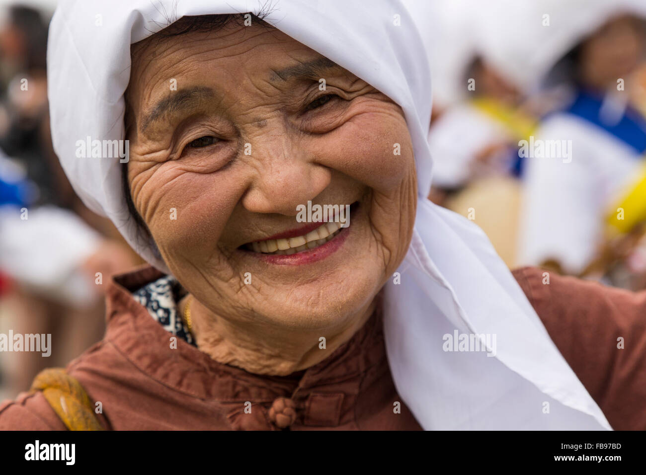 Jeju Island, South Korea. October 2015 - An Old lady dances and smile during a Fall festival in Seogwipo. Stock Photo