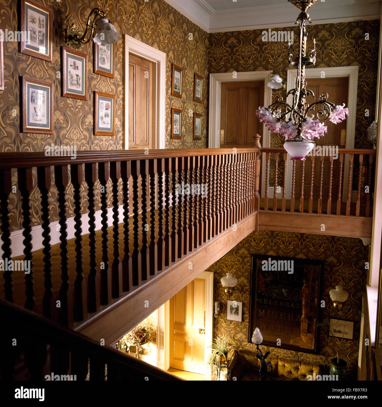 Brown Art Nouveau wallpaper on country landing with an Edwardian glass