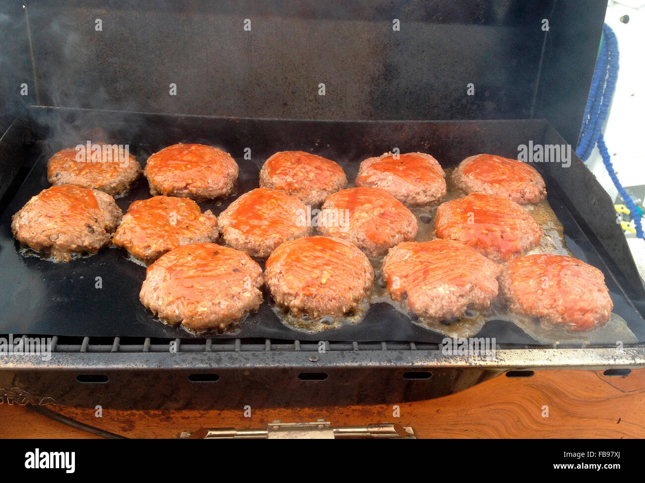 Cooking burgers on the BBQ Stock Photo