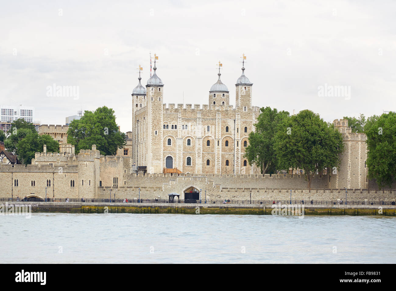 Tower of London, castle with cloudy sky and Thames river Stock Photo