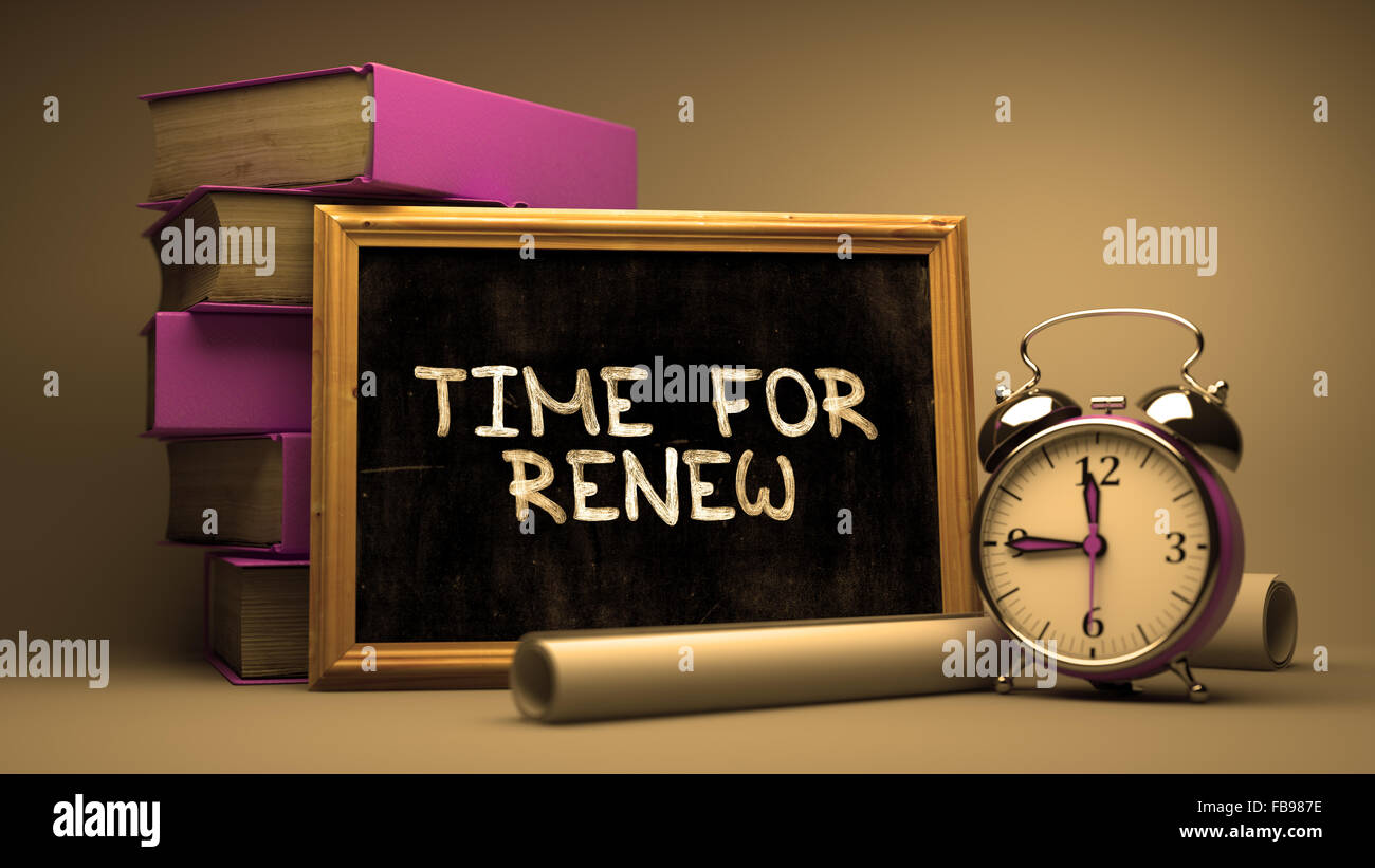 Handwritten Time for Renew on a Chalkboard. Composition with Chalkboard and Stack of Books, Alarm Clock and Rolls of Paper on Bl Stock Photo