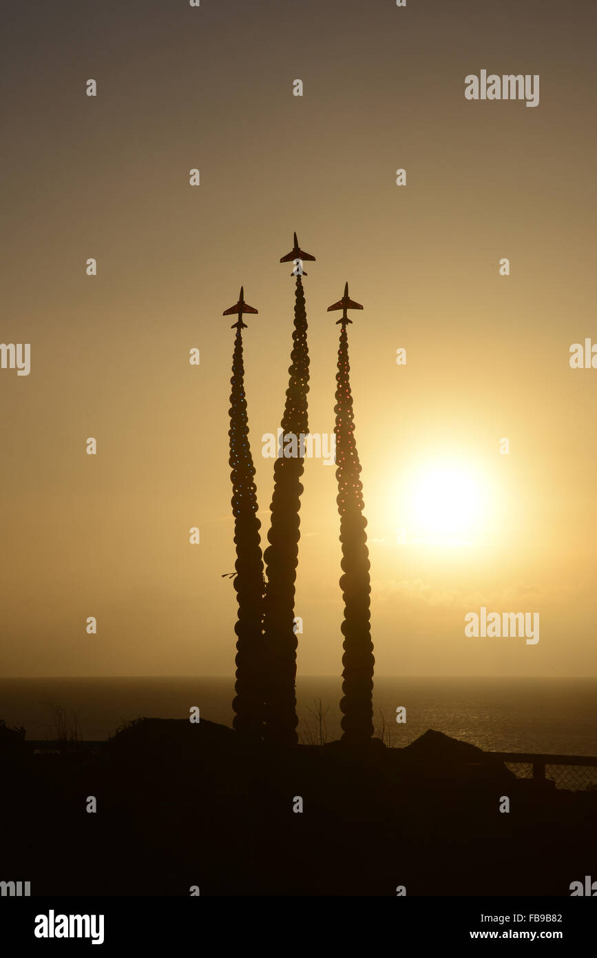 Sunrise over the memorial to Red Arrows pilot Jon Egging on Bournemouth cliff-top. Stock Photo