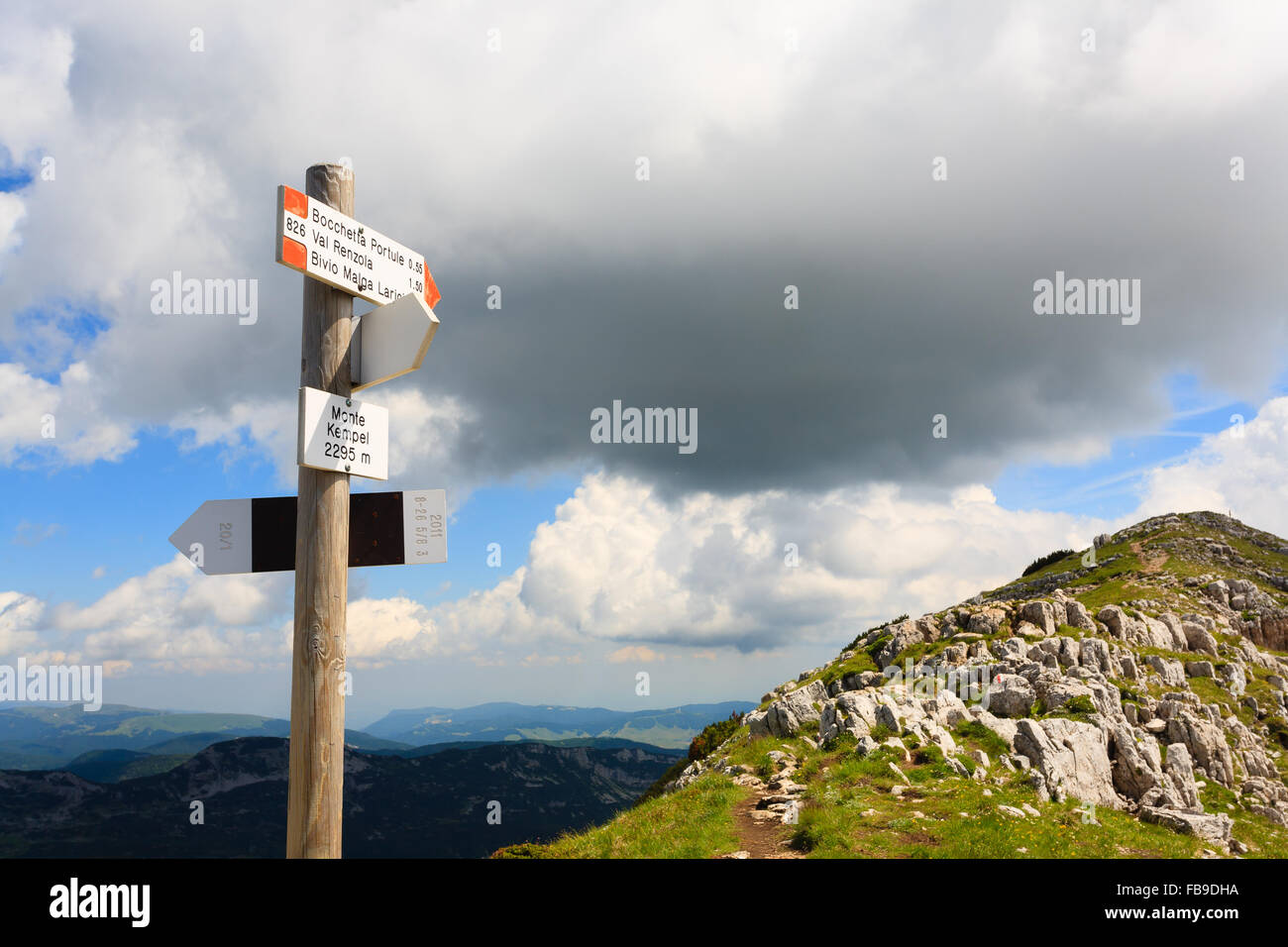 Signboard along a mountain trekking path, Italian panorama, Alps Stock Photo