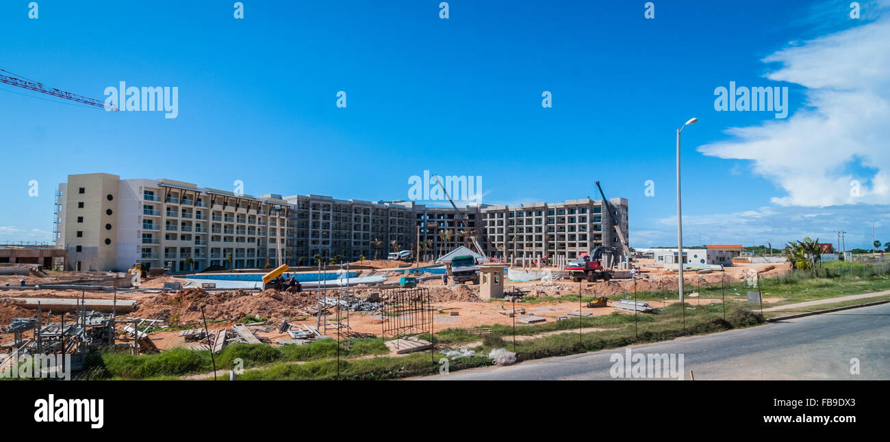 Brand new hotel being built on countryside land. construction crane