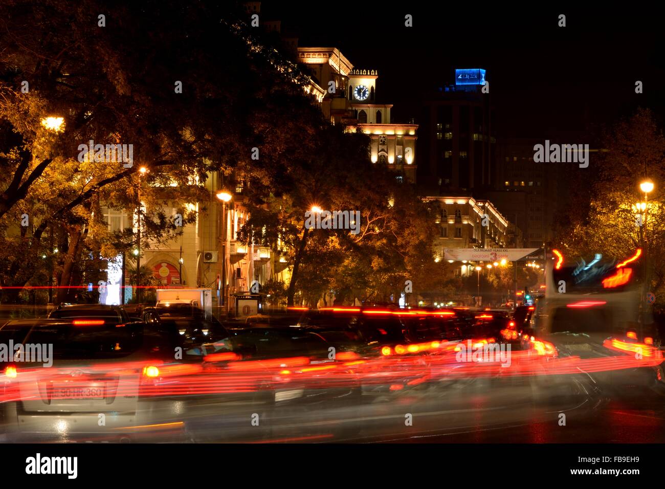 Long exposure of cars travelling up Inshaatcilar Prospekti in Baku, Azerbaijan. A night scene showing light trails from cars Stock Photo