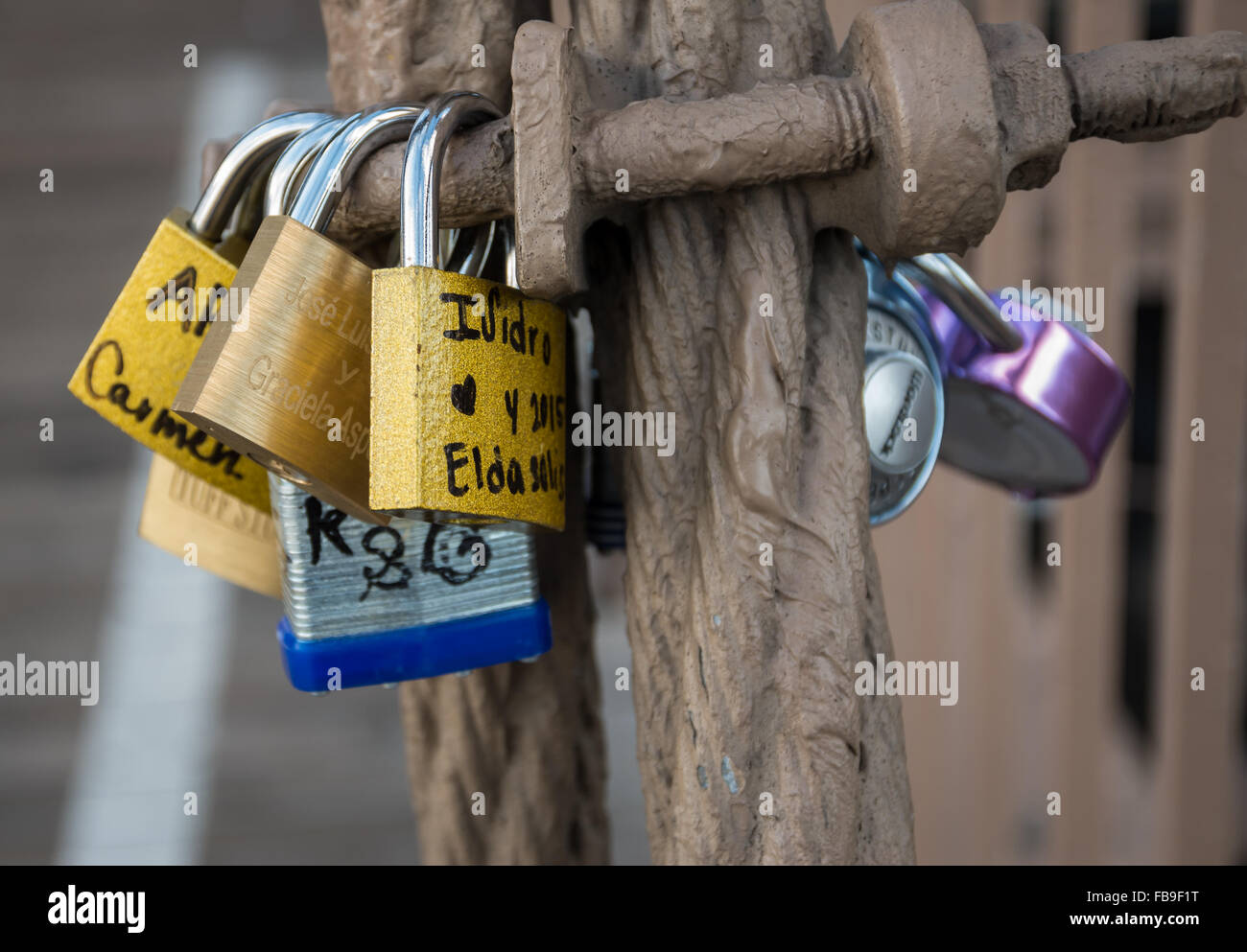 Love locks and padlocks attached to a suspension cable on Brooklyn