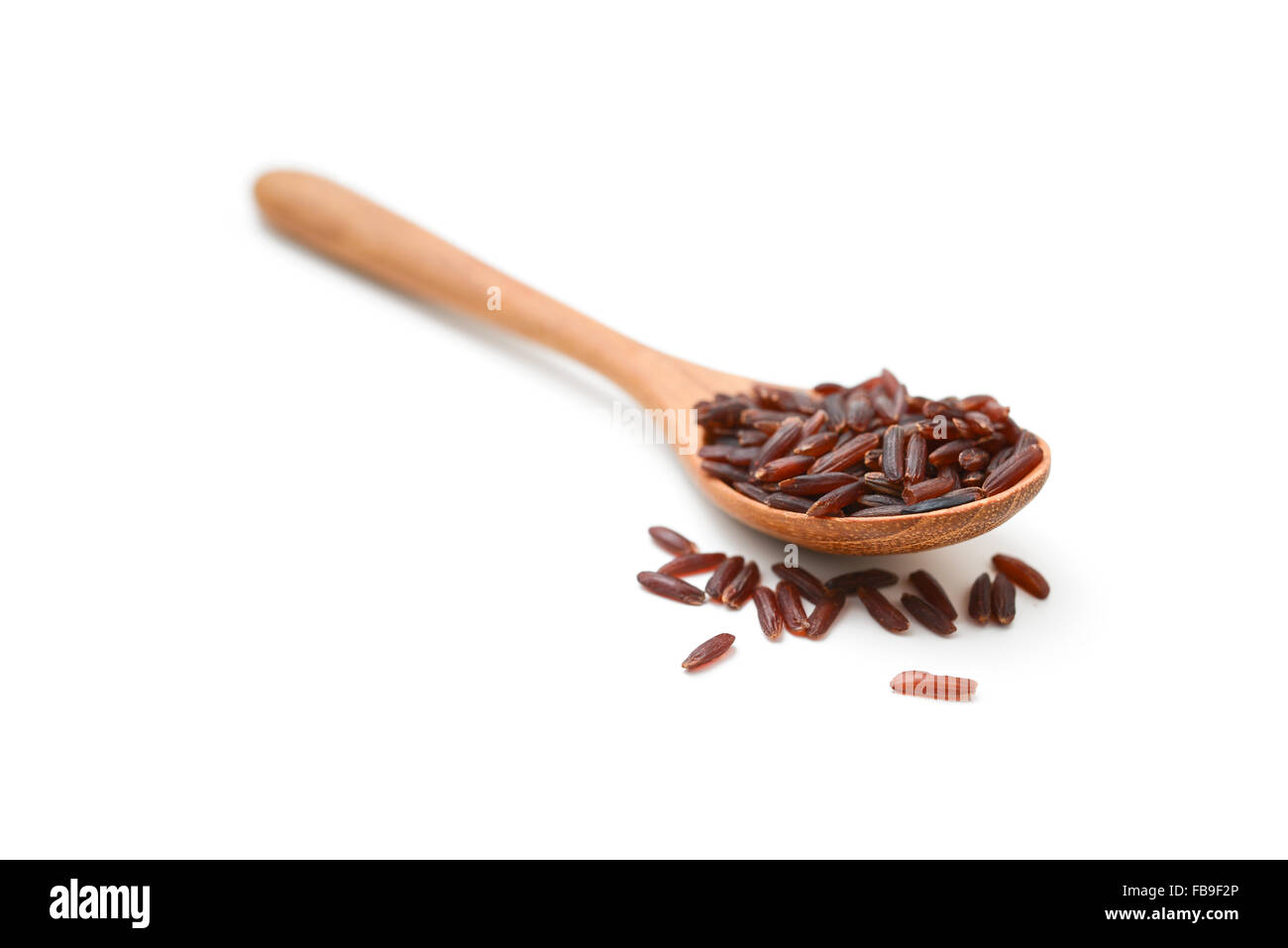 red rice with spoon Stock Photo - Alamy