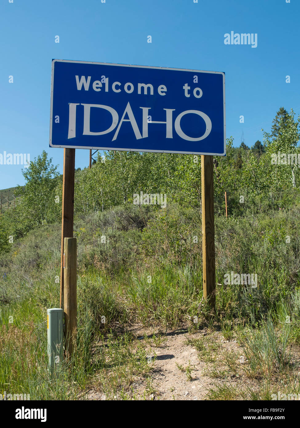 Welcome to Idaho road sign at border with Wyoming in the Tetons Stock Photo