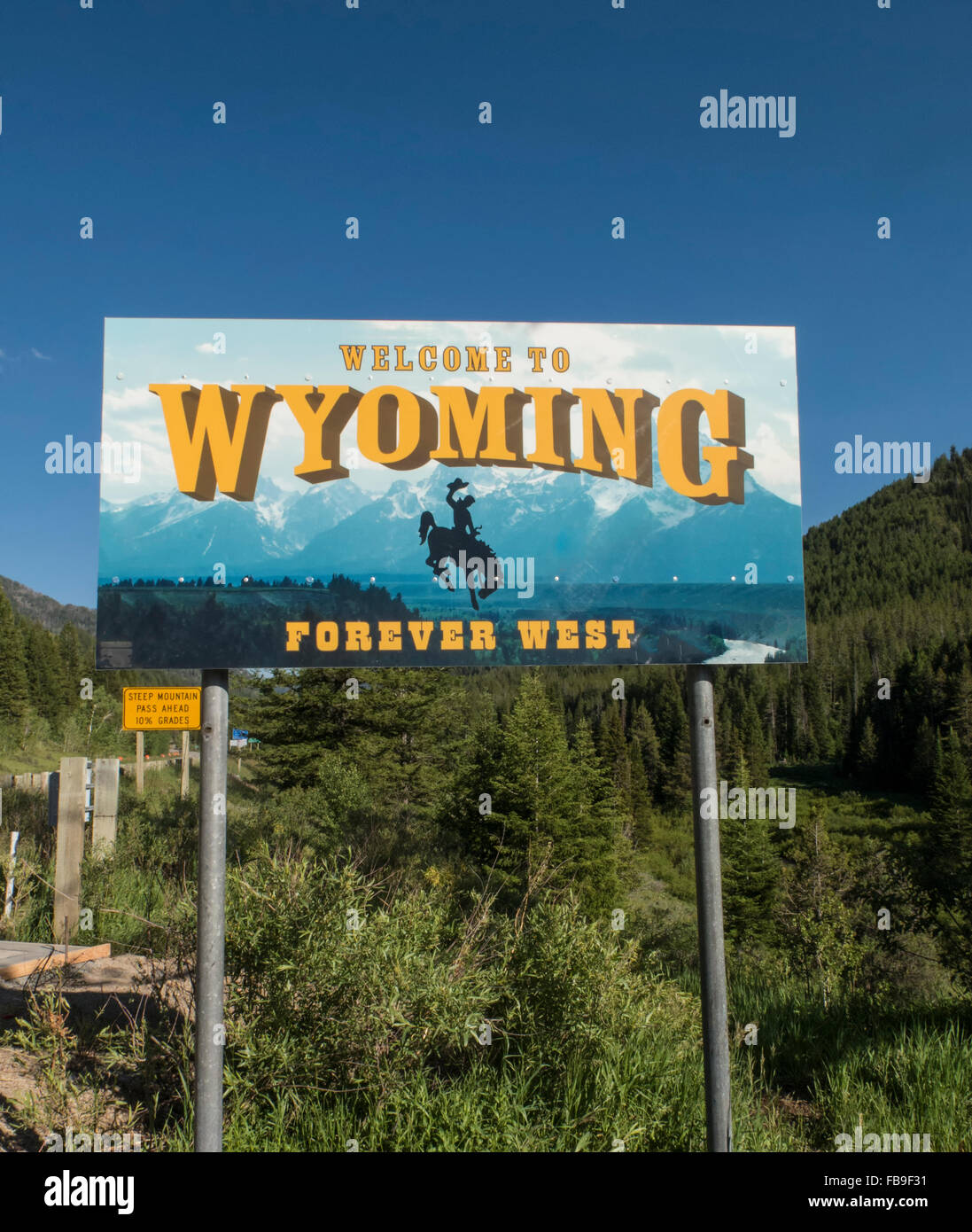 Welcome to Wyoming road sign at border with Idaho in the Tetons Stock Photo