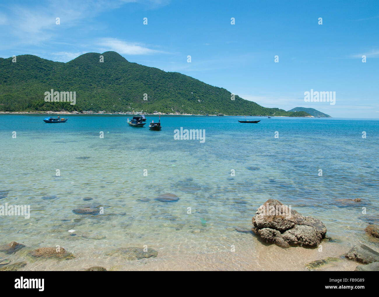 Sunny and warm tropical beach. Bay of Cham Islands near Hoi An( Hoian) and Da Nang( Danang), Central Vietnam. Stock Photo