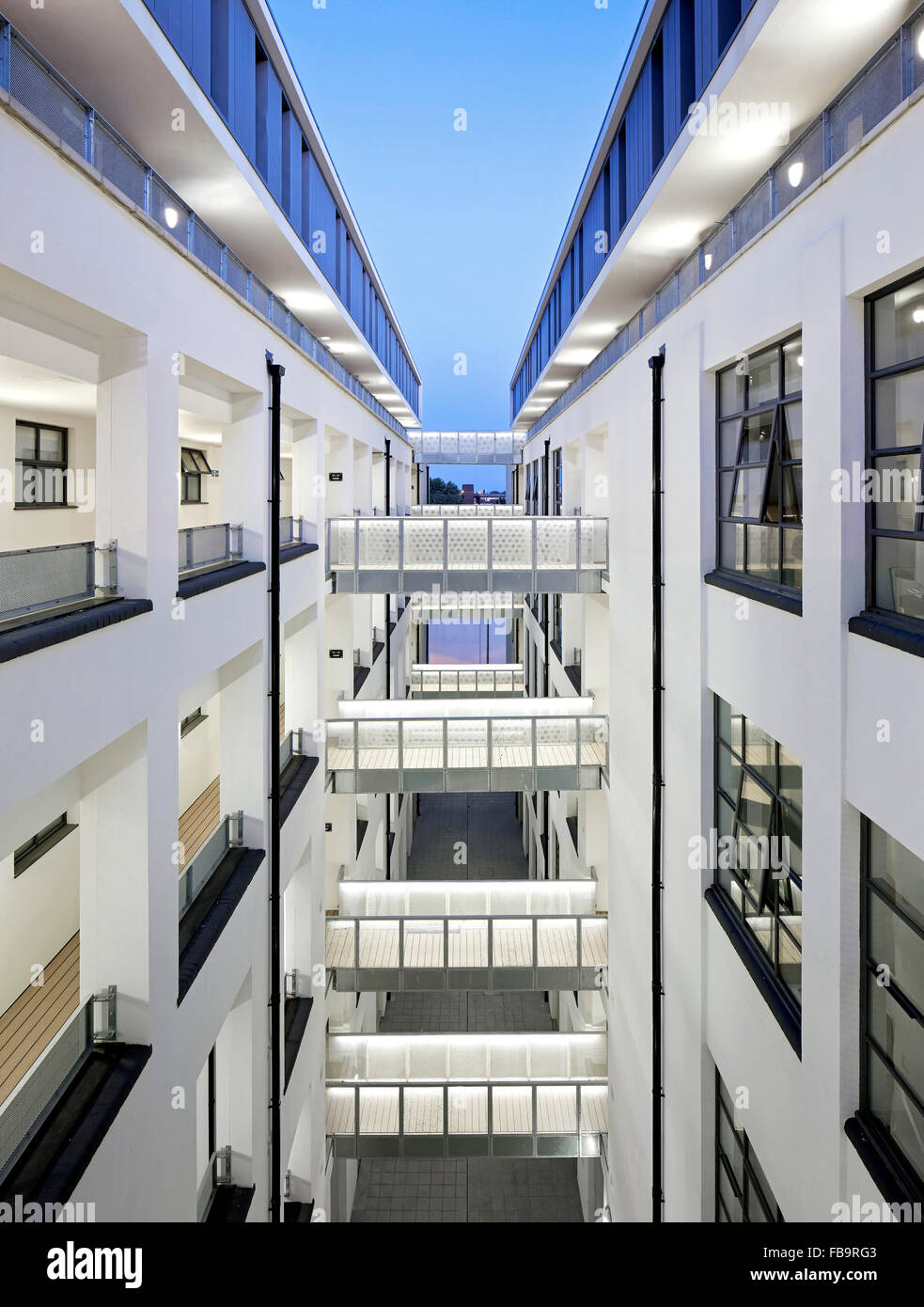 Elevated night time view of building's internal street. The Textile Building, London, United Kingdom. Architect: BGY, 2014. Stock Photo