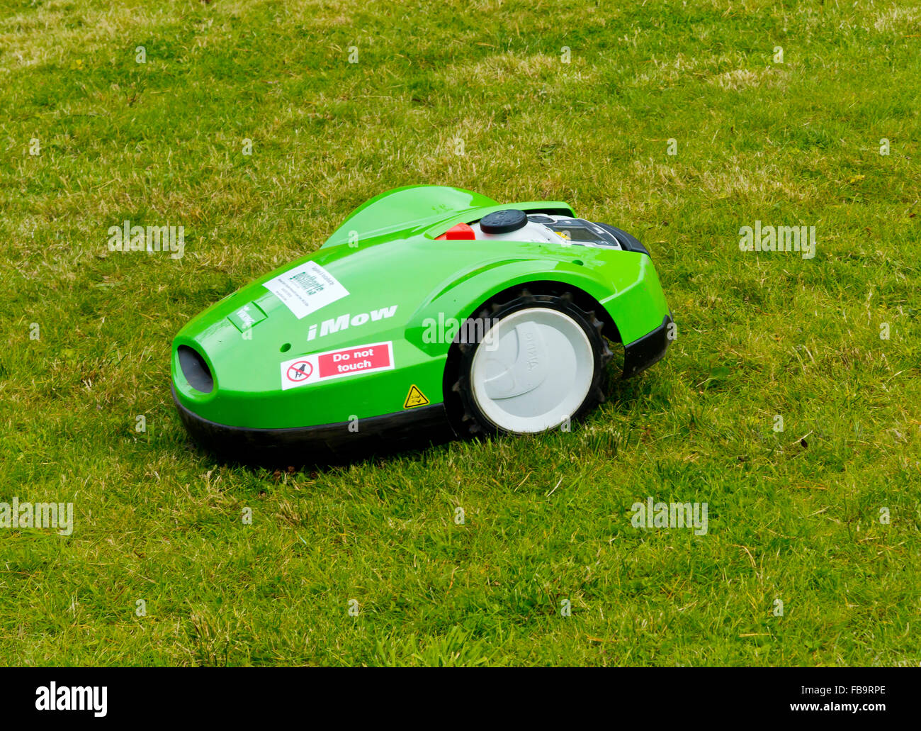 Viking Imow battery powered robotic lawn mower cutting grass using modern technology Stock Photo