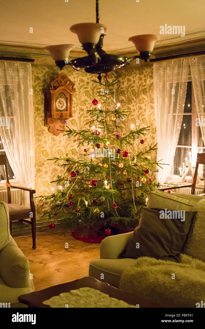 Christmas tree inside house window hires stock photography and images