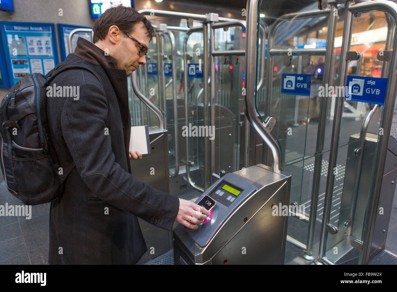 All Dutch transport companies started in collaboration with telephone companies (Vodafone and KNP) an experiment in which commuters can  check in and out by mobile phone on public transport. Stock Photo