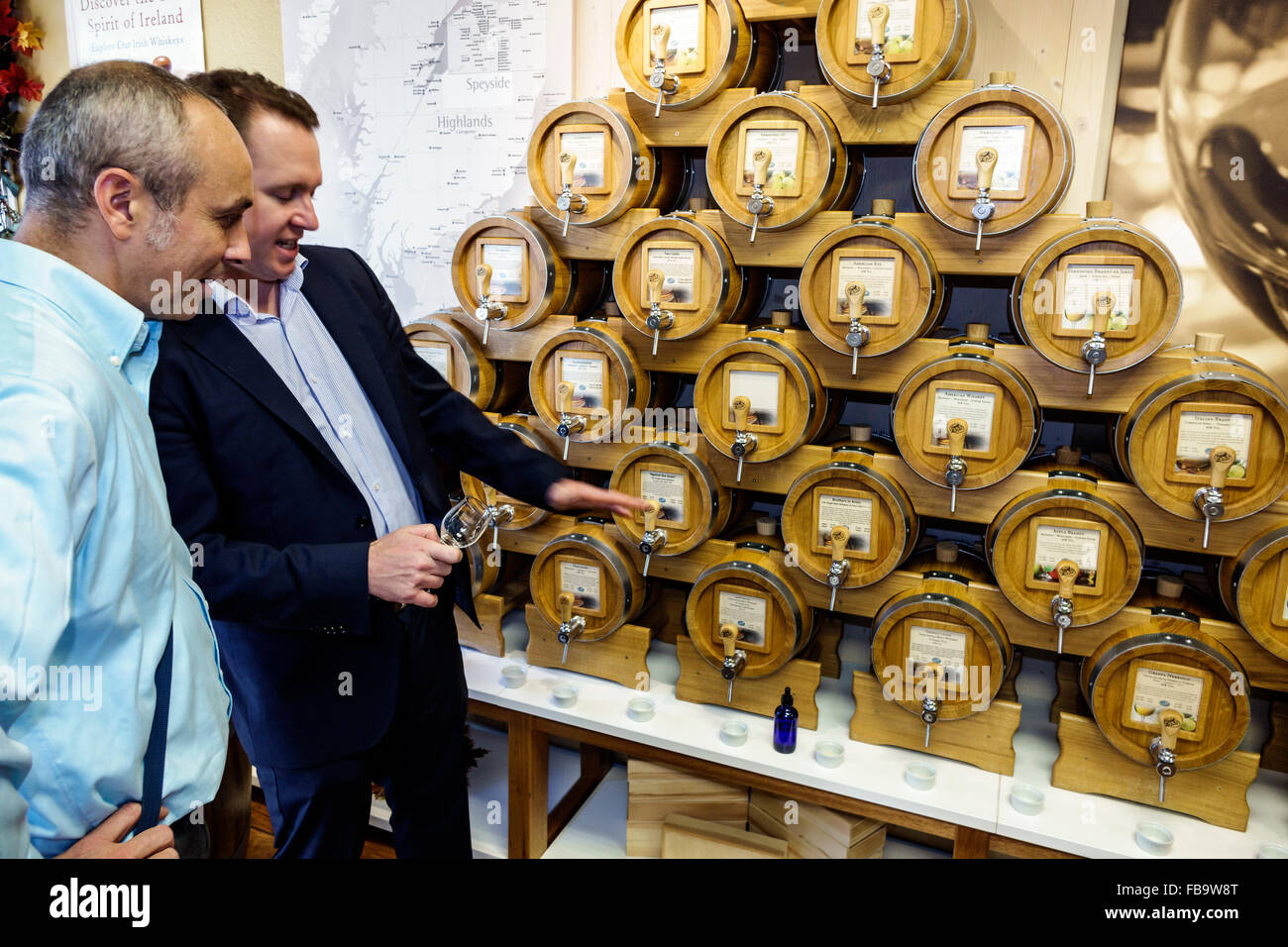 Sarasota Florida,Main Street,Vom Fass Oils Vinegars Spirits Wines,mini kegs,tasting,adult adults man men male,explaining,free sample samples,product,v Stock Photo