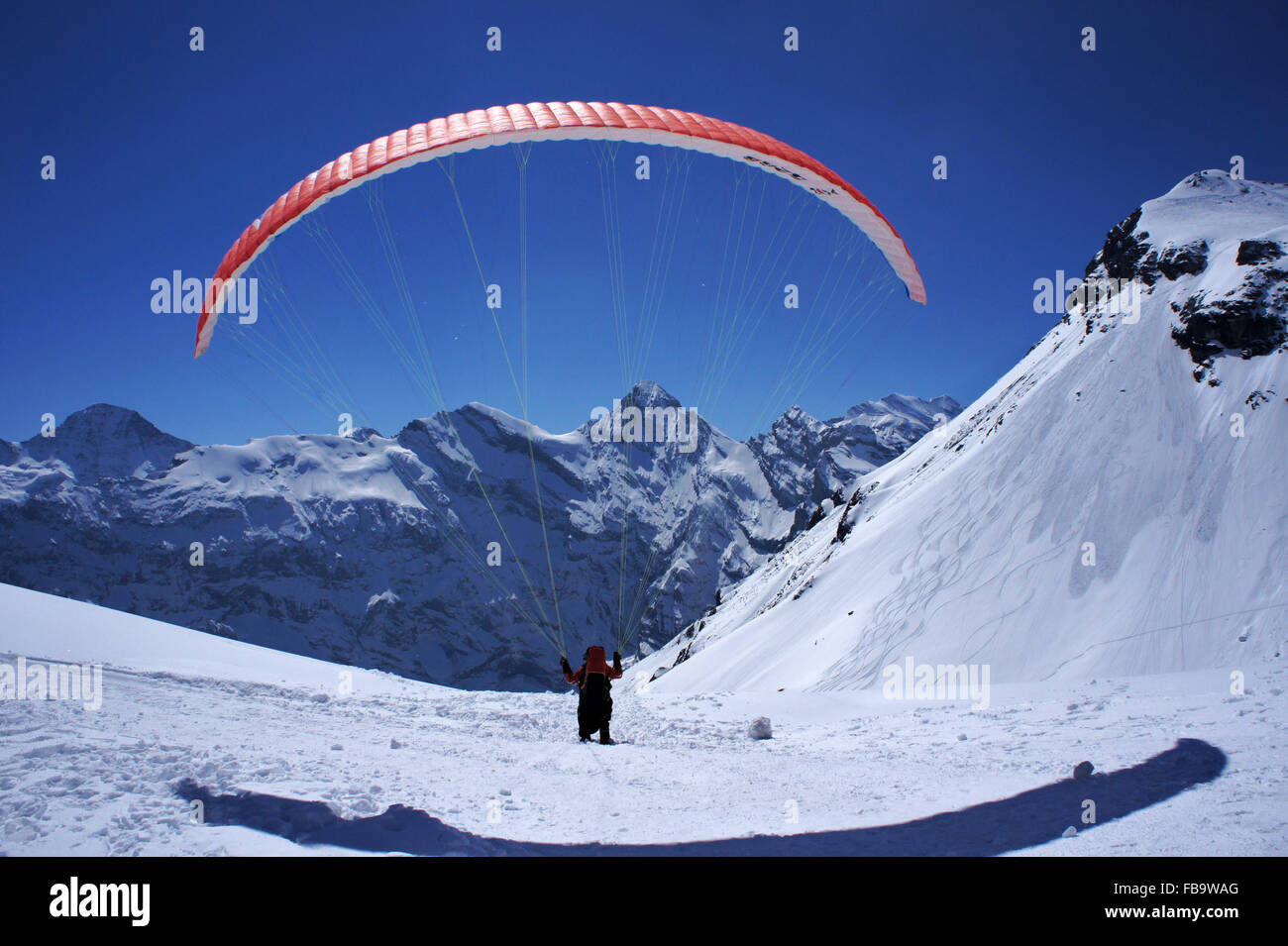 Parasail taking off below summit of Schilthorn, Mürren, Bernese alsp, Switzerland Stock Photo