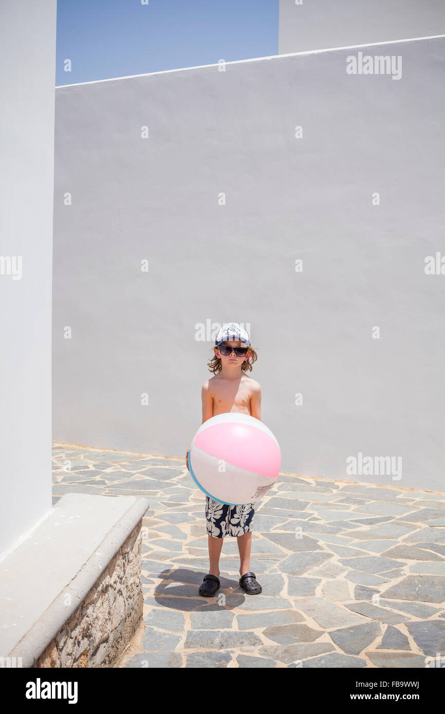 Greece, Karpathos, Amopi, Boy (8-9) standing with ball Stock Photo