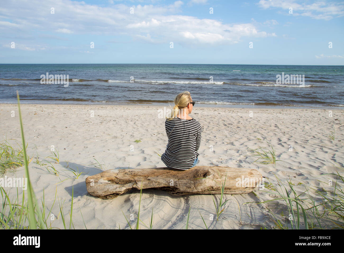 Mature woman enjoying herself on the beach Stock Photo - Alamy