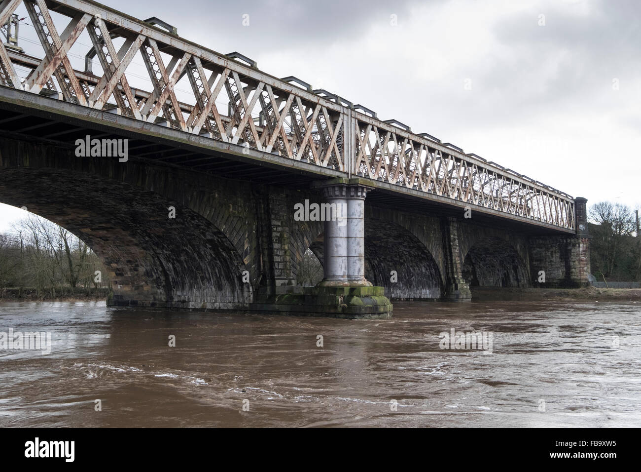 The railway bridge on the west-coast line spanning the River Ribble close to Preston Railway Station in the centre of the city. Stock Photo