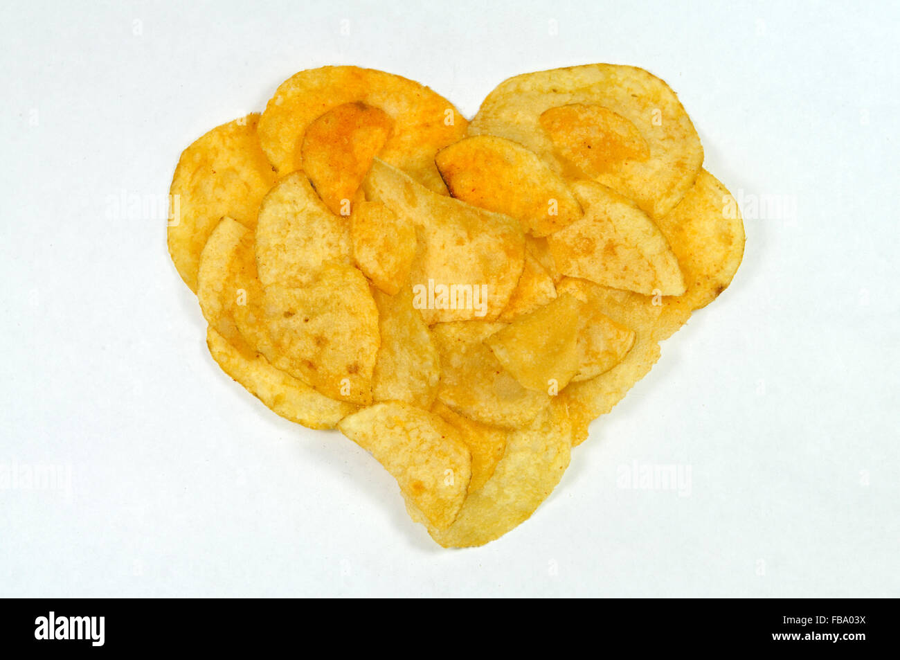 Crisps in the shape of a heart. Stock Photo