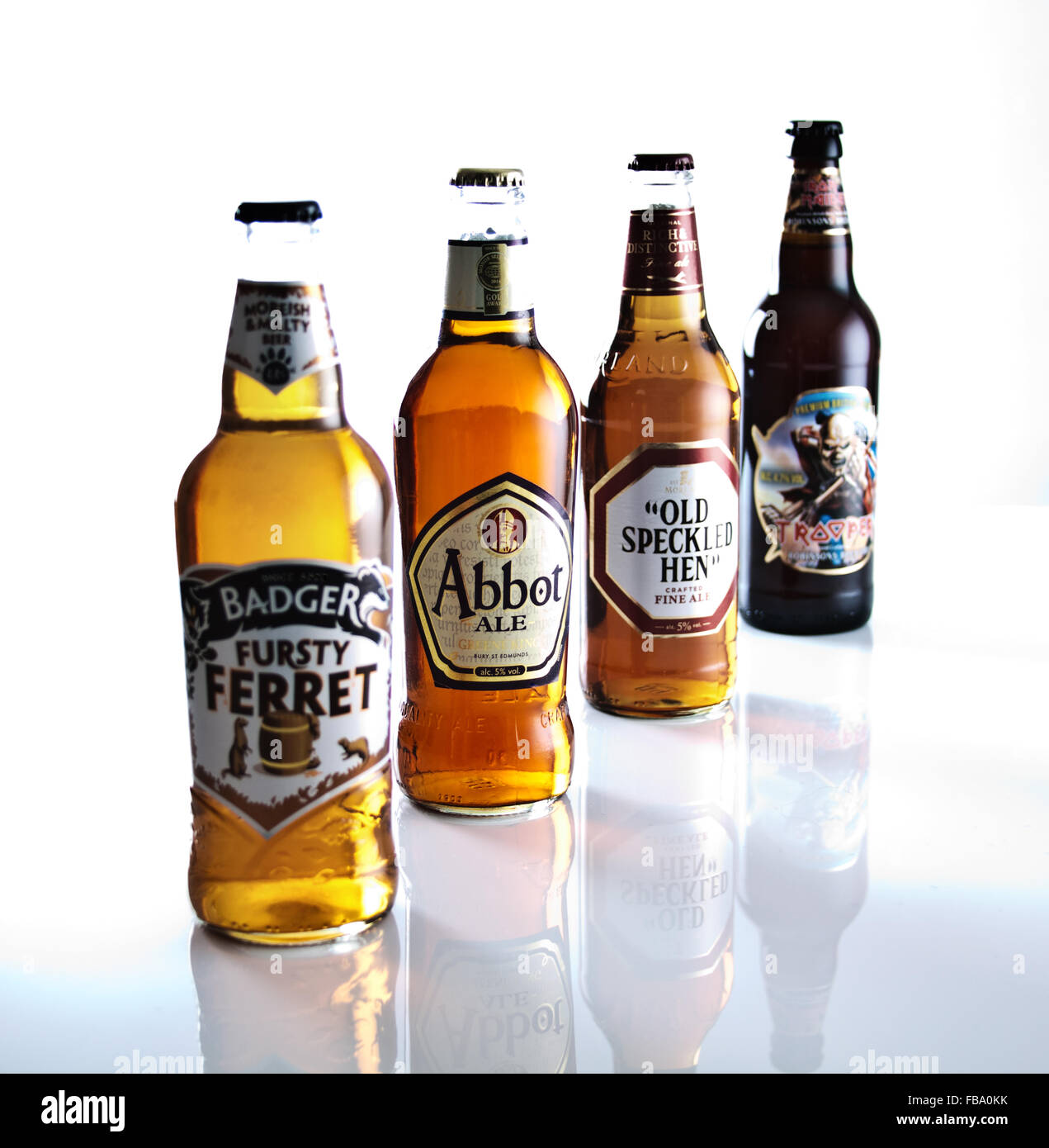 Four colourful beer bottles arranged to show depth of field and emphasise brand Stock Photo