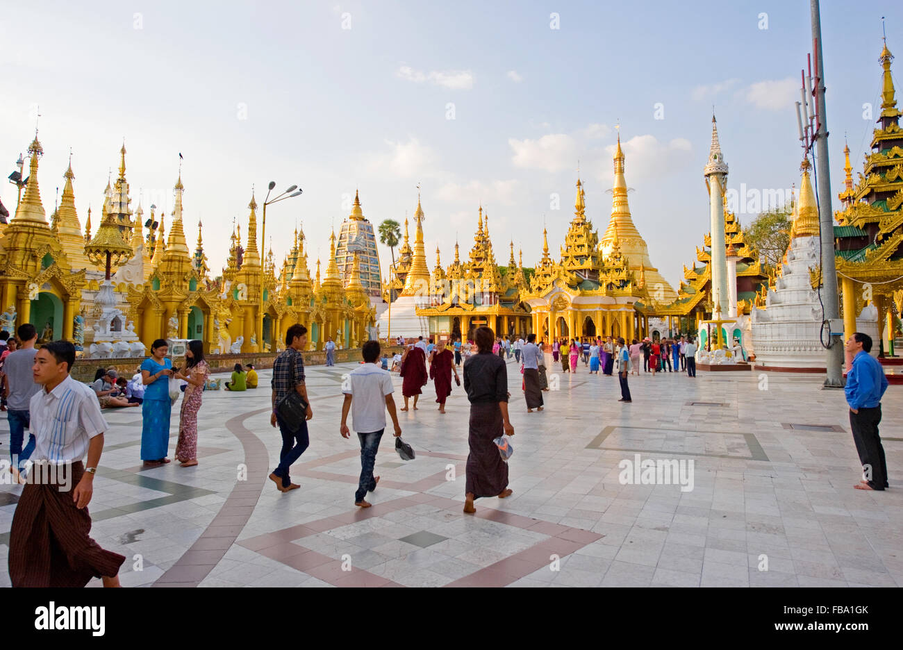 Visitors inside the Shwedagon Paya, Yangon, Myanmar Stock Photo