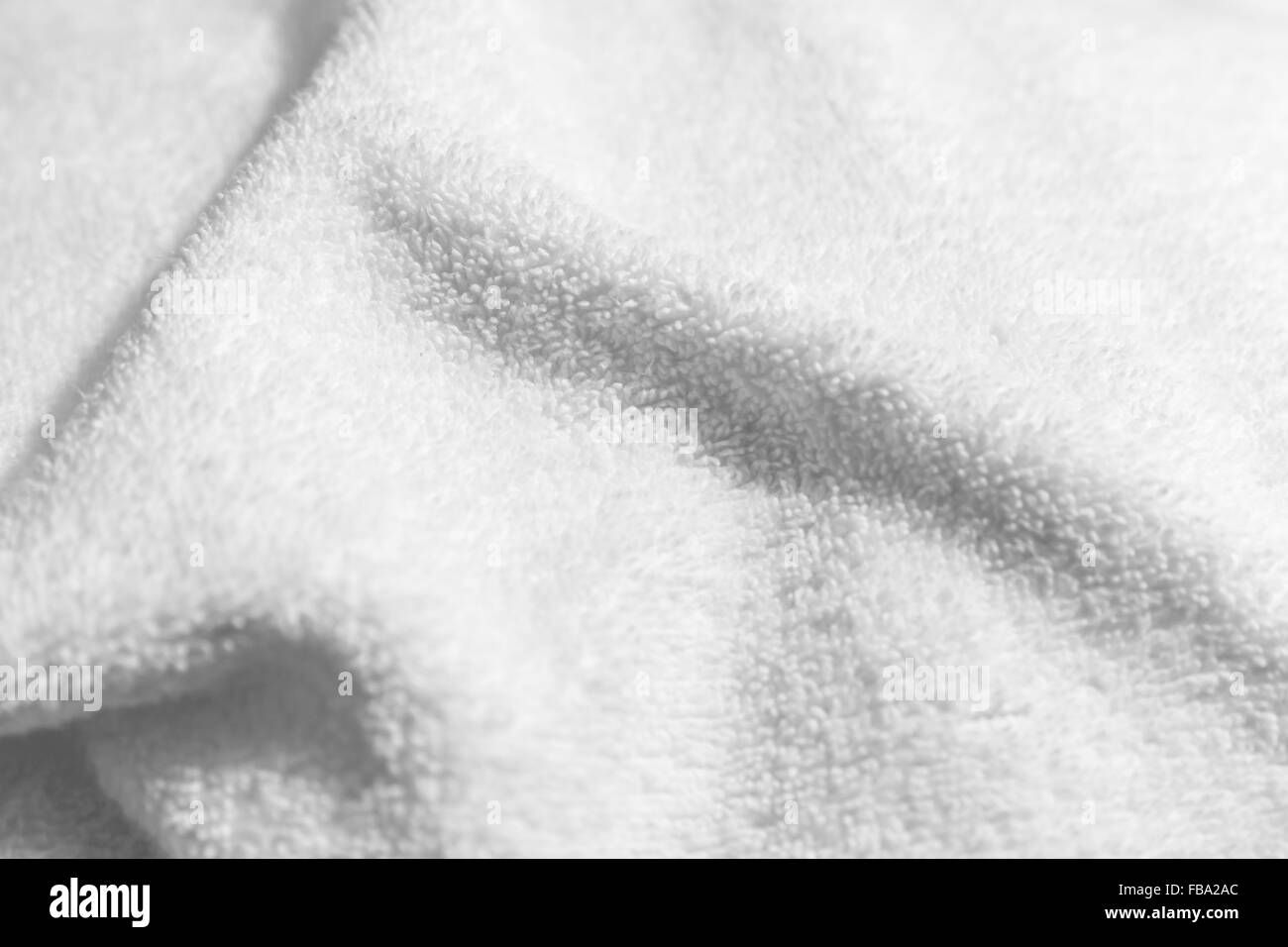 White natural cotton towel  background, closeup photo with selective focus Stock Photo
