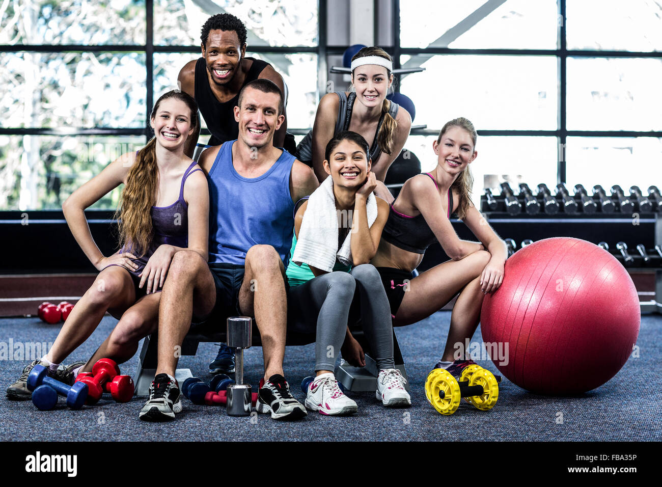 Smiling fitness class posing together Stock Photo Alamy