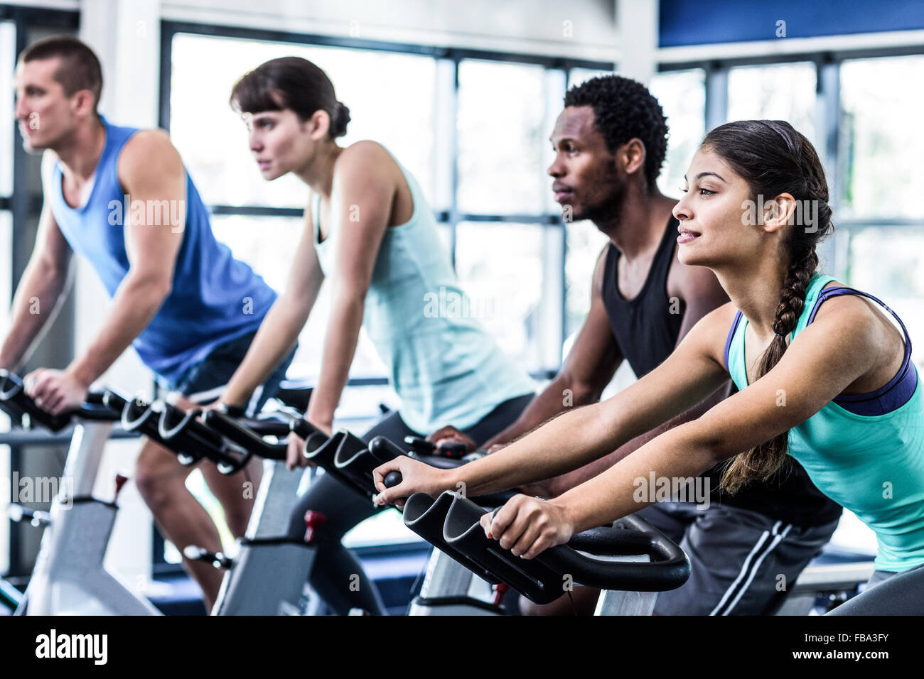 Fit people working out at spinning class Stock Photo - Alamy