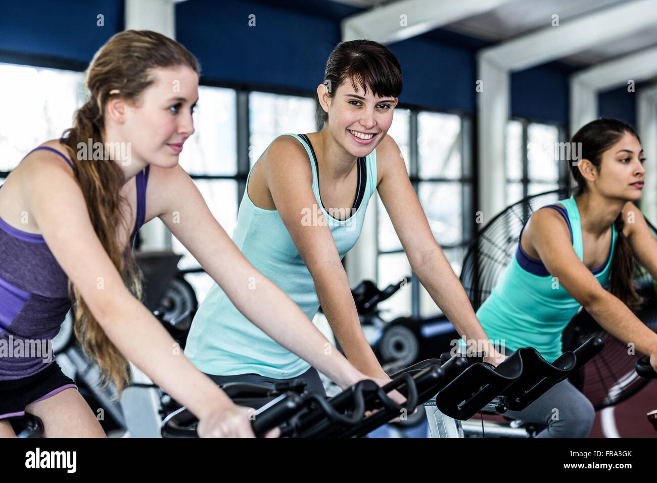 Fit woman working out at spinning class Stock Photo - Alamy