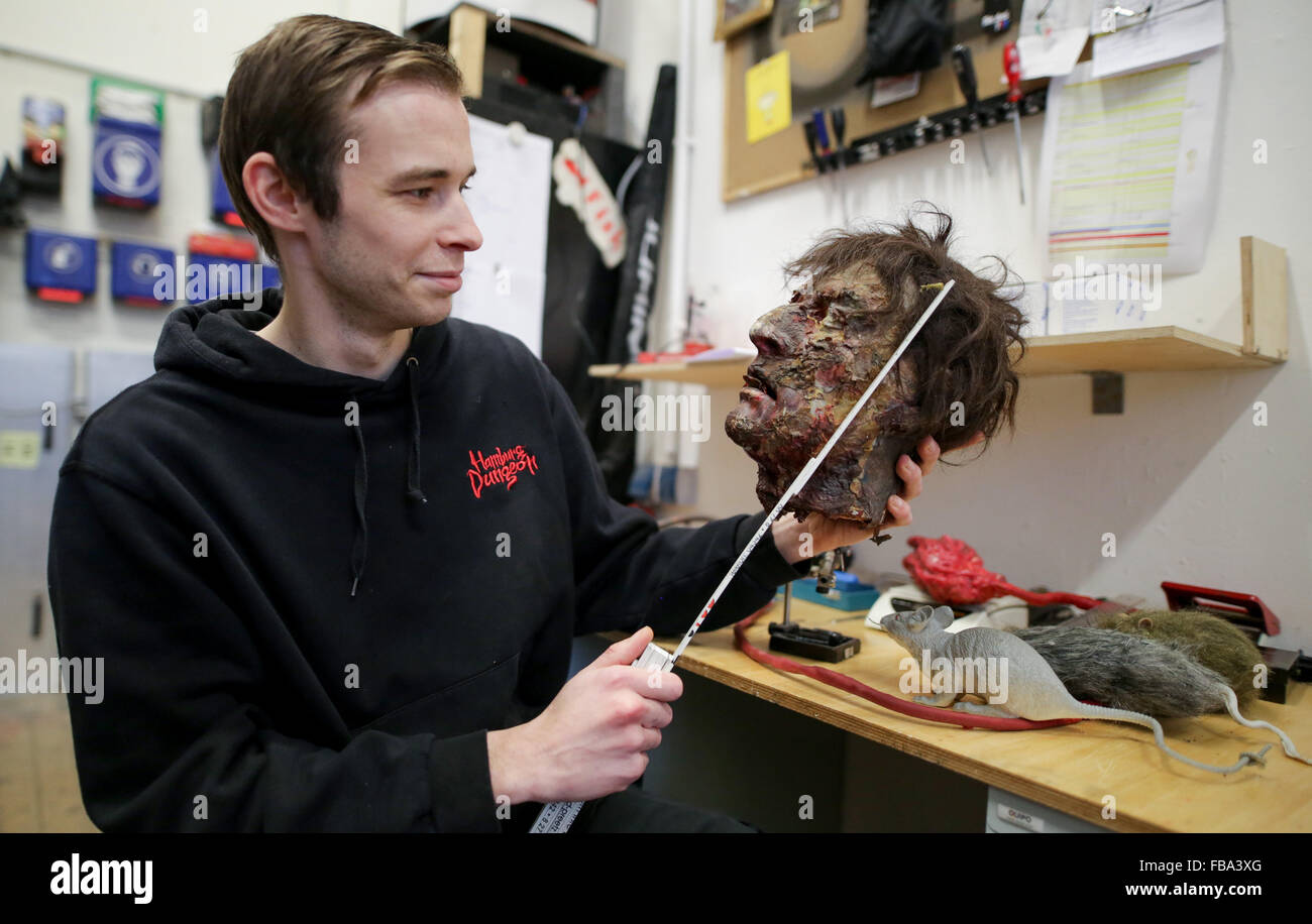 Technician Mario measures the head of a 'corpse' in the 'Hamburg Dungeon' in Hamburg, Germany, 13 January 2016. In the 'Dungeon,' combining show, chamber of horrors, and fun rides, the entire operation will be reviewed during an annual inventory. Photo: AXEL HEIMKEN/dpa Stock Photo