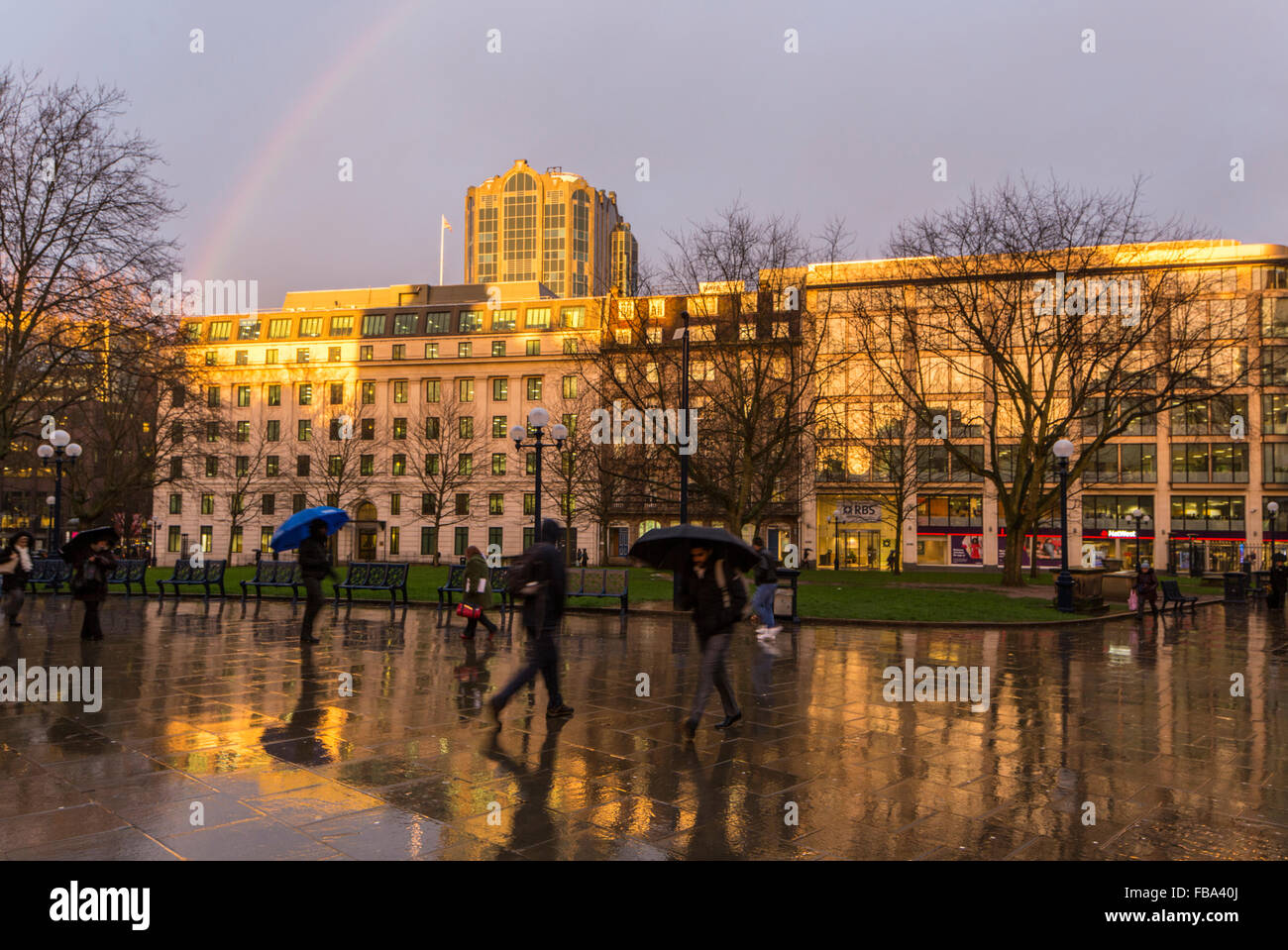 Birmingham, UK. 12th January 2016. as the bad weather continues, shoppers are caught in a late afternoon downpour near St Philip’s Cathedral, Colmore Row, Birmingham, England, UK Credit:  paul weston/Alamy Live News Stock Photo