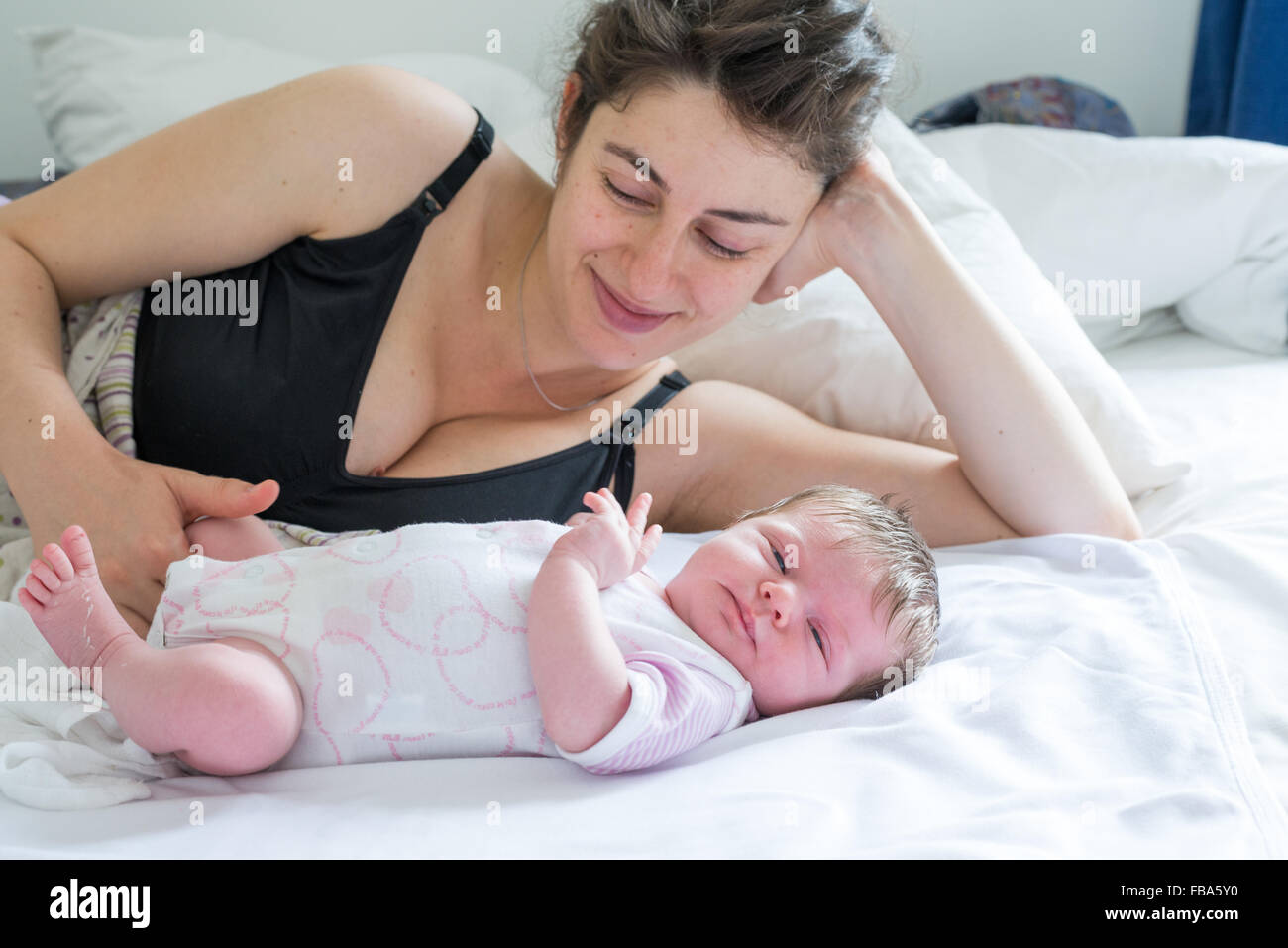 Happy young mother with her newborn baby Stock Photo