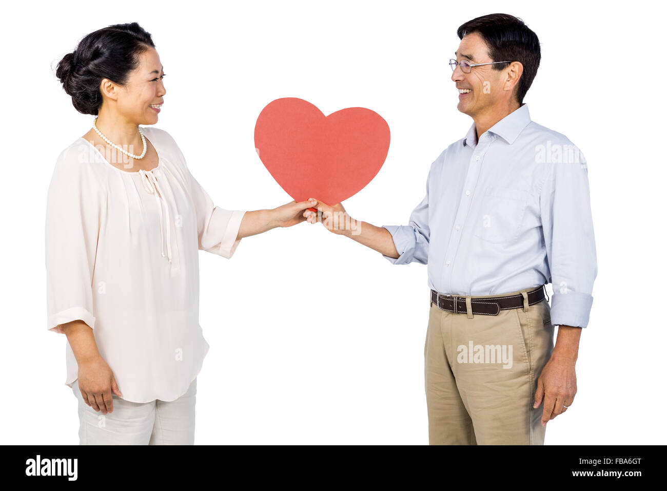 Older asian couple holding heart Stock Photo - Alamy