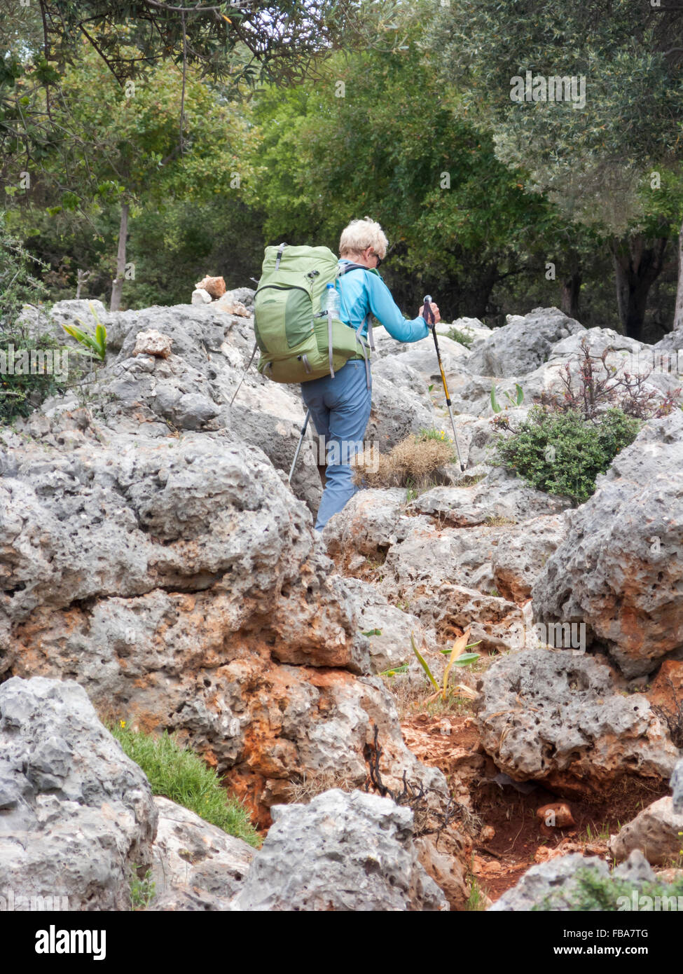 Woman backpacker walking the Lycian Way near Ucagiz, Turkey Stock Photo