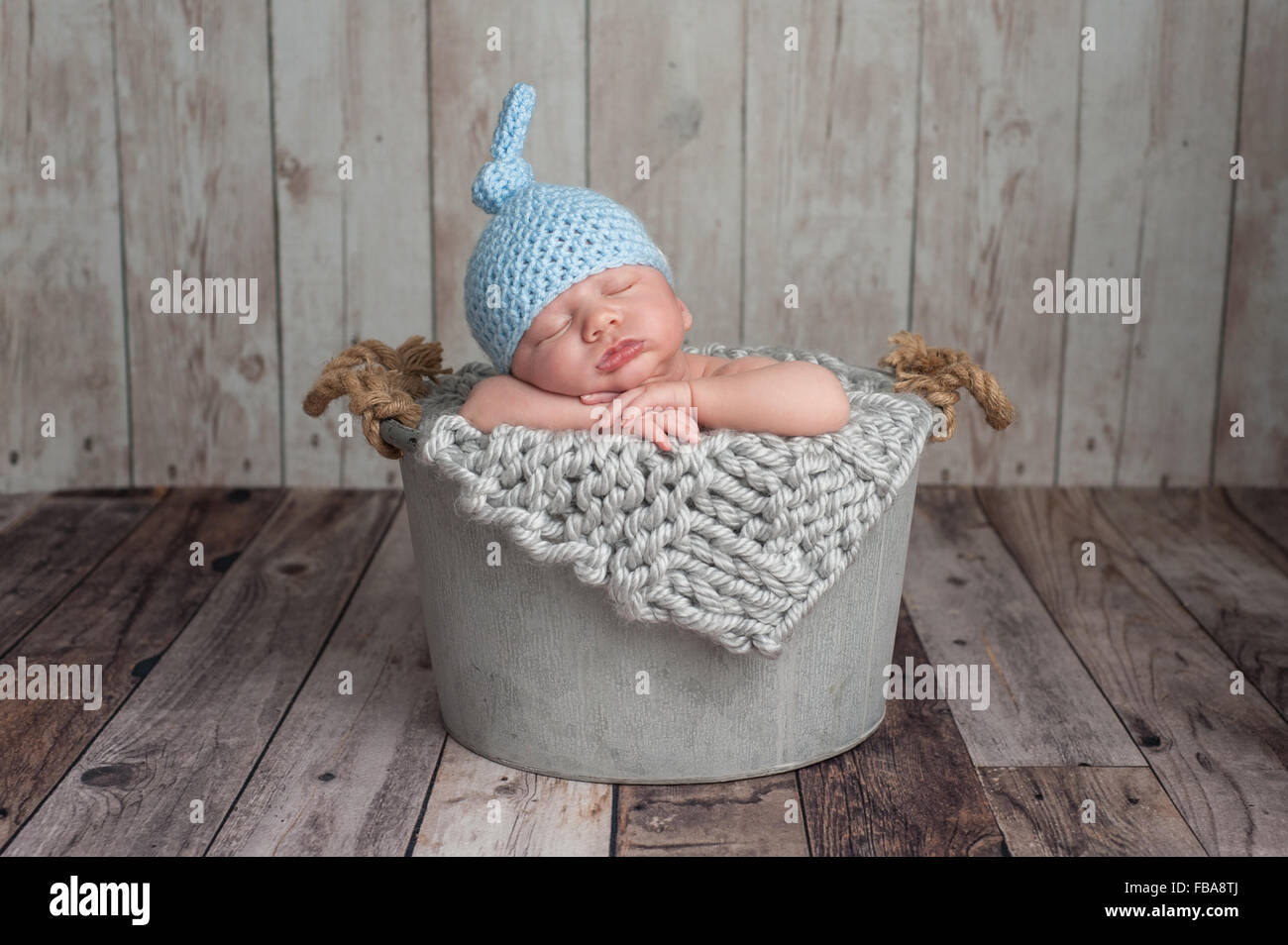 Baby Newborn Sleeping In Woolen Hat On White Wooden Background, Warm Winter Country  Style Stock Photo, Picture and Royalty Free Image. Image 27462458.