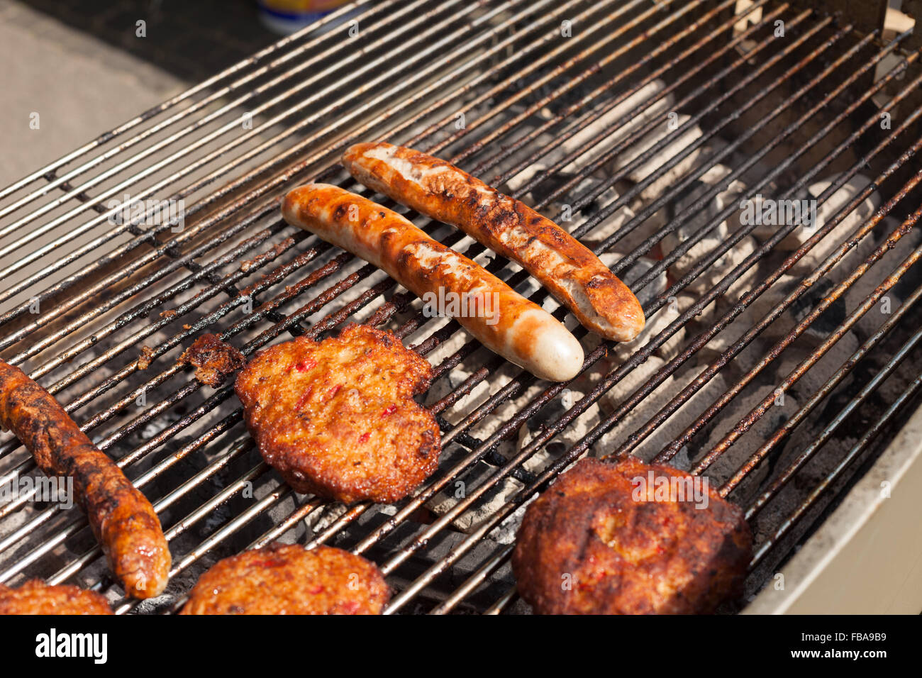 Thuringian sausage (Thueringer Rostbratwurst) and frikadeller (frikadelle)  on a grill Stock Photo - Alamy