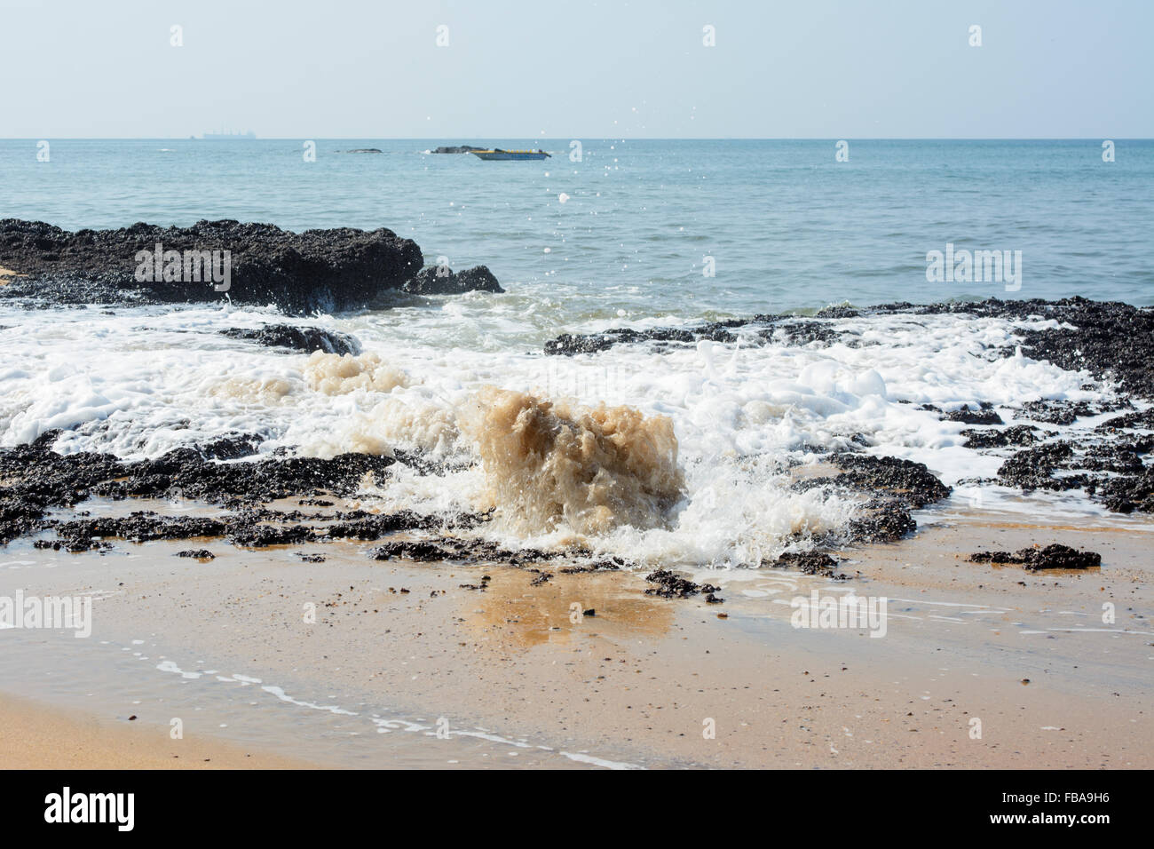 The bubbling rocks of Anjuna beach in North Goa, India Stock Photo - Alamy