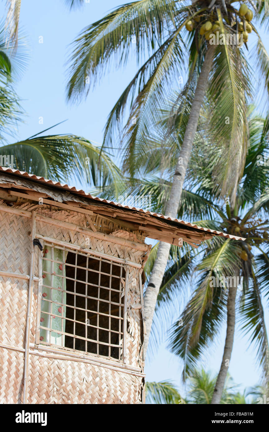 A rustic beach hut among the palm trees on Mandrem beach, North Goa, India Stock Photo