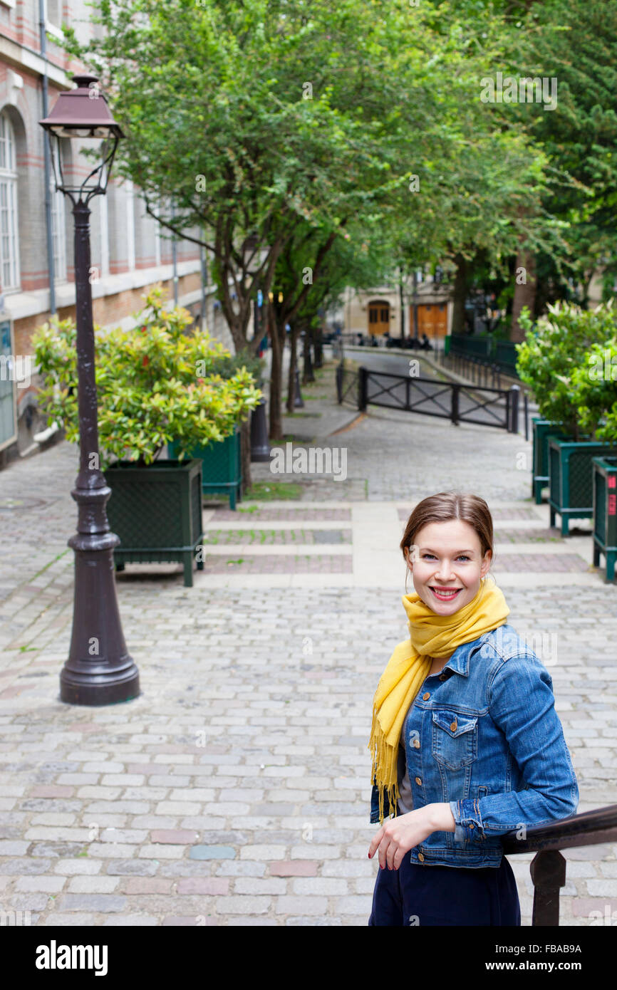 France, Ile-de-France, Paris, Portrait of young woman wearing denim jacket Stock Photo