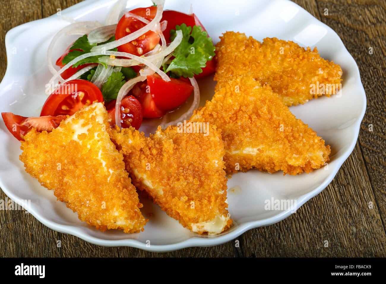 Fried cheese triangles with vegetables salad Stock Photo Alamy