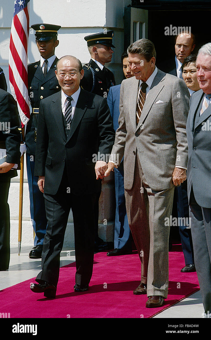 Washington, DC., USA, 26th April, 1985 President Ronald Reagan meets with President Chun Doo Hwan of the Republic of Korea at the White House. Note that Reagan is holding Chun's hand as they walk out from the South Portico door.  Credit: Mark Reinstein Stock Photo
