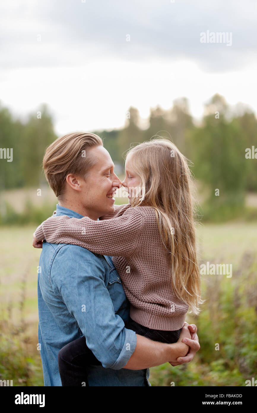 Finland, Uusimaa, Raasepori, Karjaa, Father and daughter (6-7) rubbing noses Stock Photo