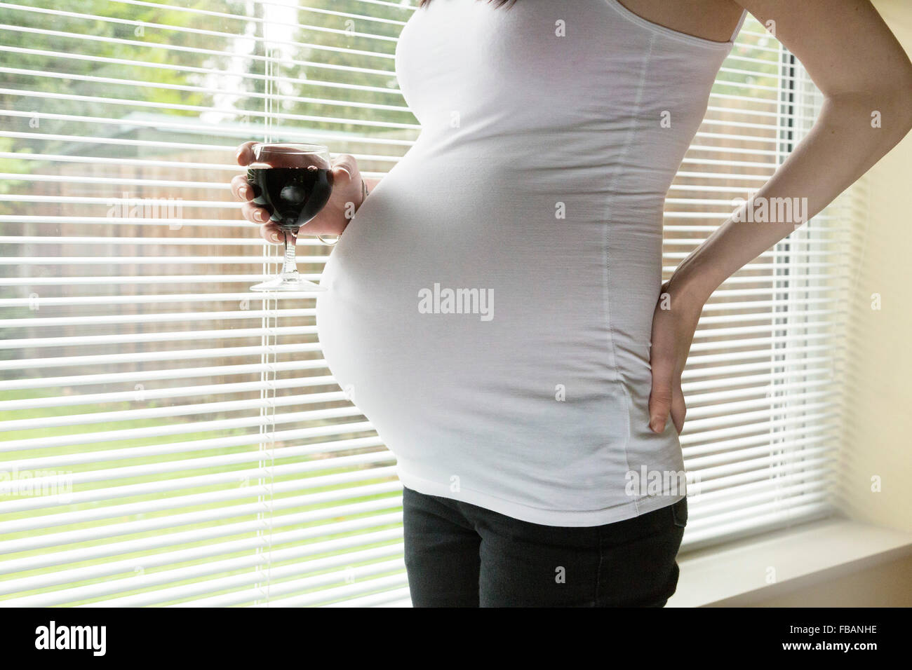 pregnant woman drinking alcohol / red wine Stock Photo Alamy