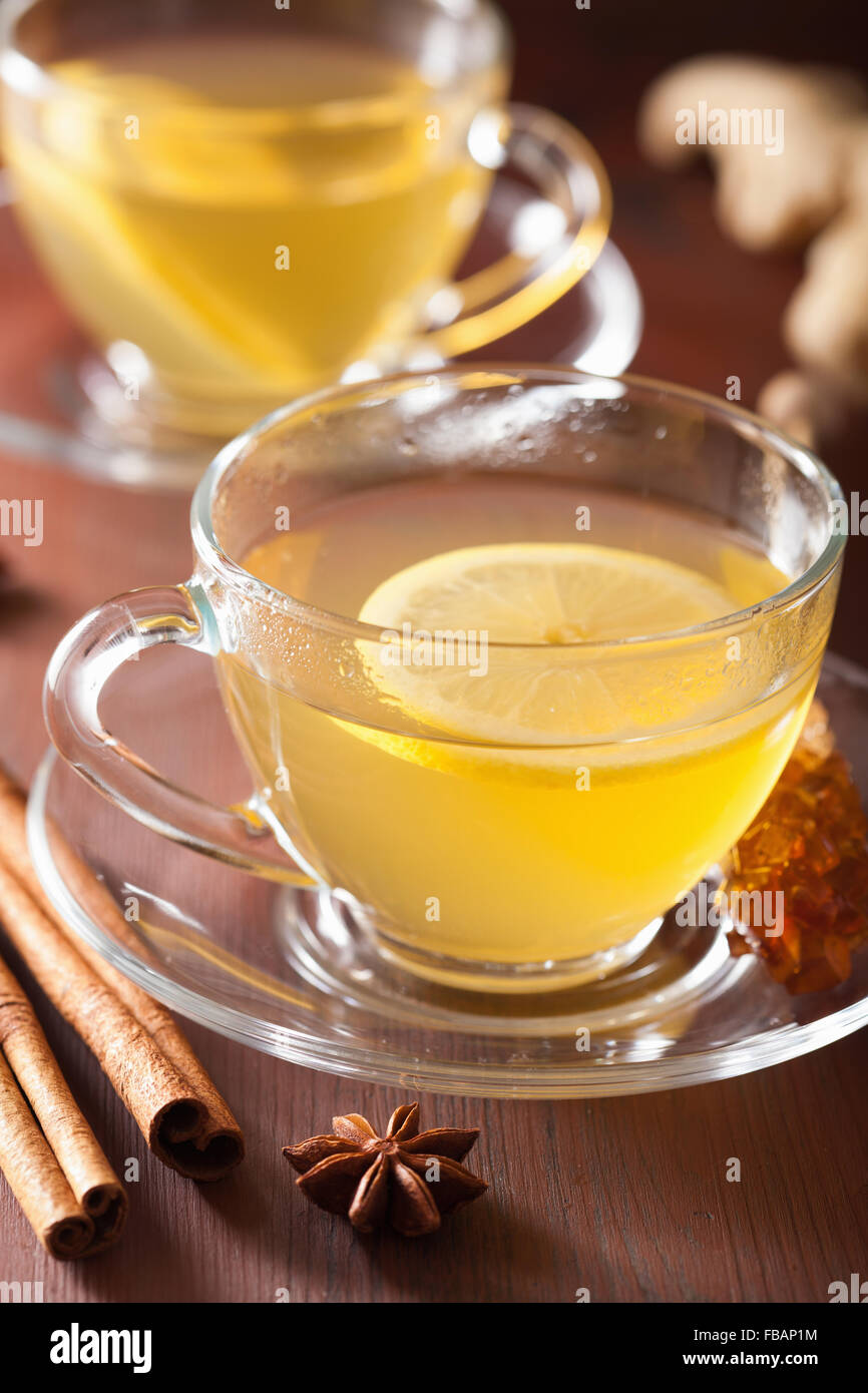 hot lemon ginger cinnamon tea in glass cup Stock Photo