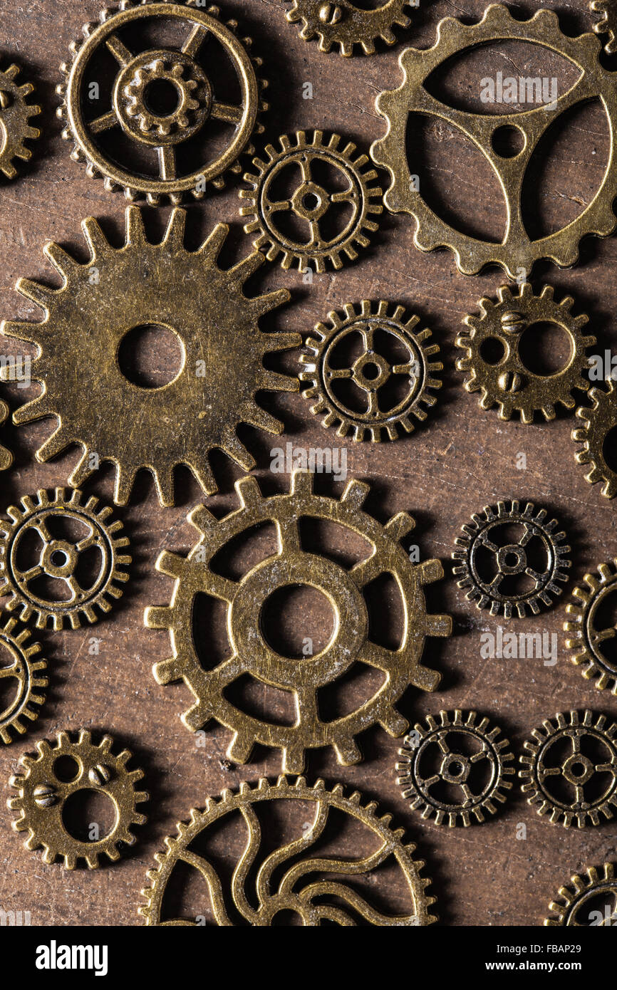 steampunk mechanical cogs gears wheels on wooden background Stock Photo ...