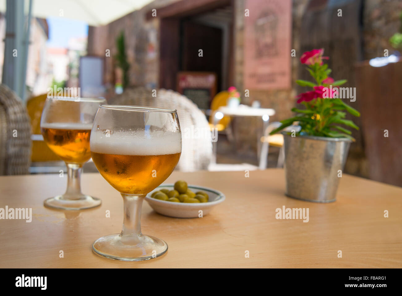 Two glasses of beer and green olives in a terrace. Medinaceli, Soria province, Castilla Leon, Spain. Stock Photo
