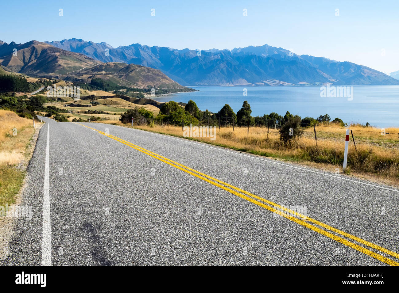 On an empty road, passing Lake Hawea, nr Wanaka, New Zealand Stock Photo